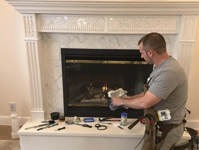 Maple Heights Chimney Sweep performing fireplace maintenance in Maple Heights, OH